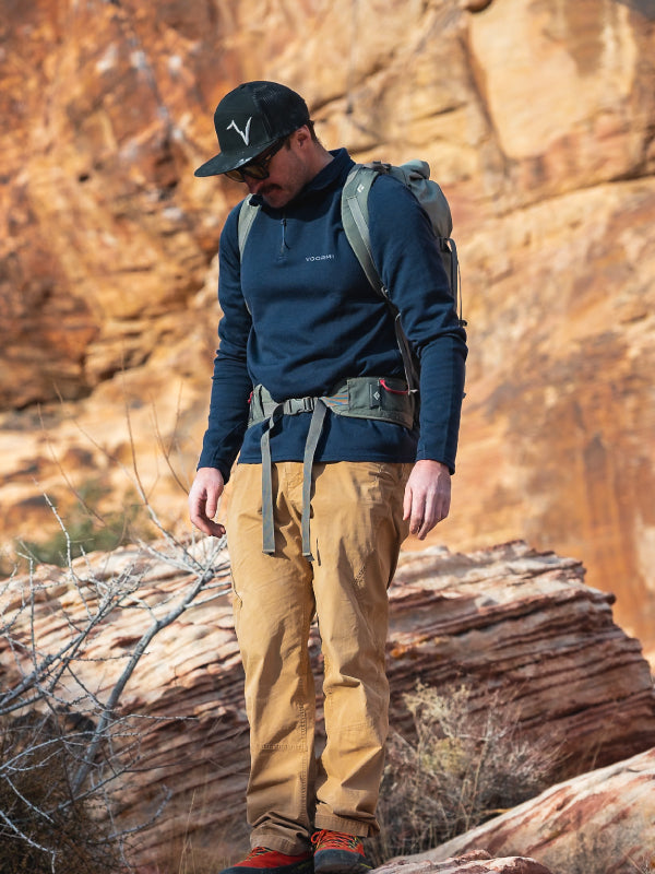 Man against a Sedona Mountain Climbing wall  wearing VOORMI gear